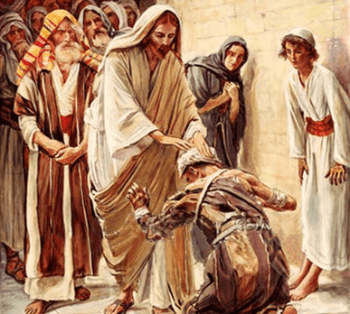 Jesus is laying his hands on a man kneeling before him so he can be cured. There are many witnesses observing the healing.