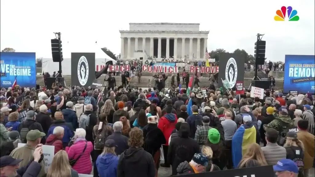 A large crowd gathered in Washington, D.C., to protest with their Remove The Regime and Impeach, Convict, Remove signs. 