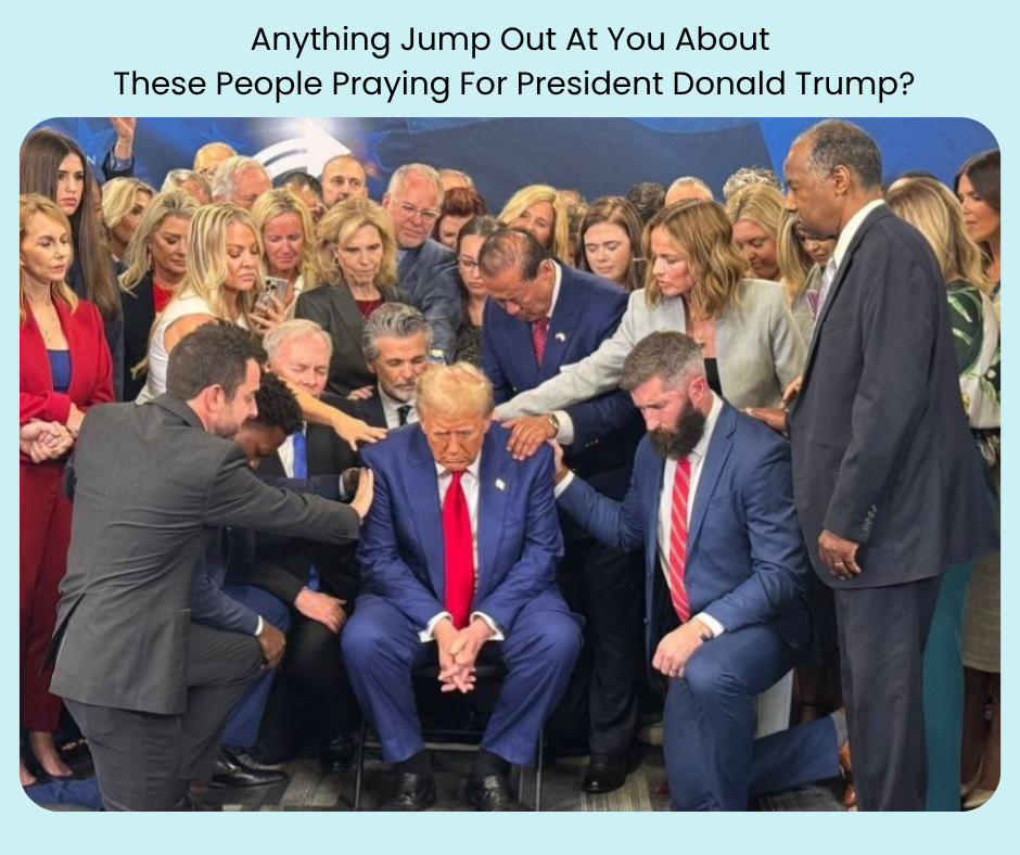 A large group of women and men, some laying hands on Trump as they pray for him.